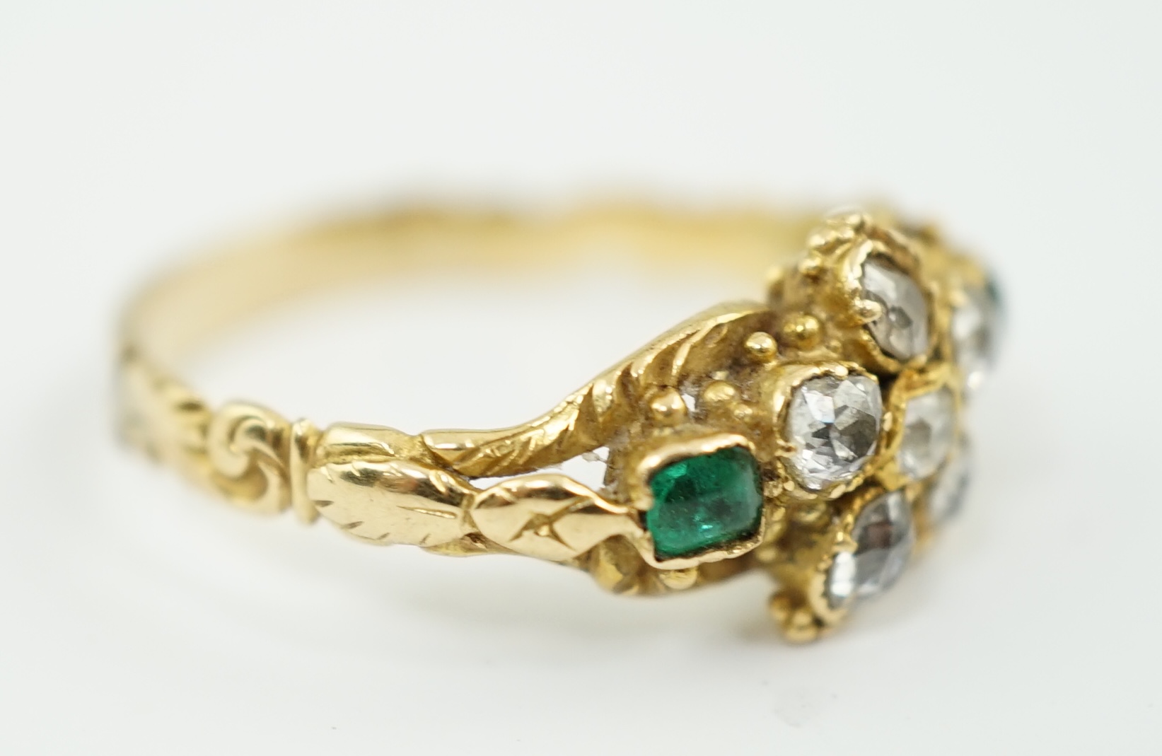 A Victorian gold, emerald and diamond set cluster ring